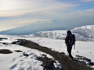 Walk on snow covering the peaks of Africa’s highest mountain